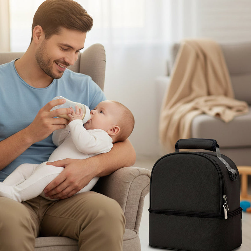 Père donne lait à bébé à côté de sac isotherme biberon spacieux noir