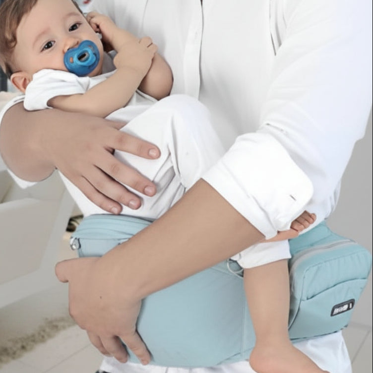 Père endort bébé dans porte bébé hanche convivial