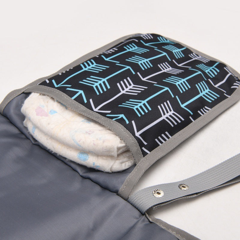 Rangement couche dans matelas à langer de voyage confort nomade