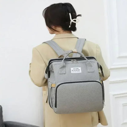 Sac-à-dos-à-langer-voyage-gris