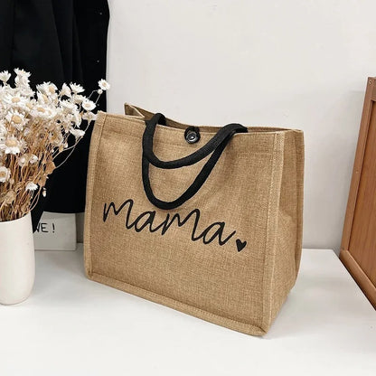 Sac-à-langer-bébé-mama-sur-table-et-fleurs