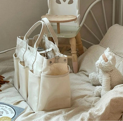 Sac-à-langer-printanier-fourre-tout-sur-matelas-avec-peluche-ourson
